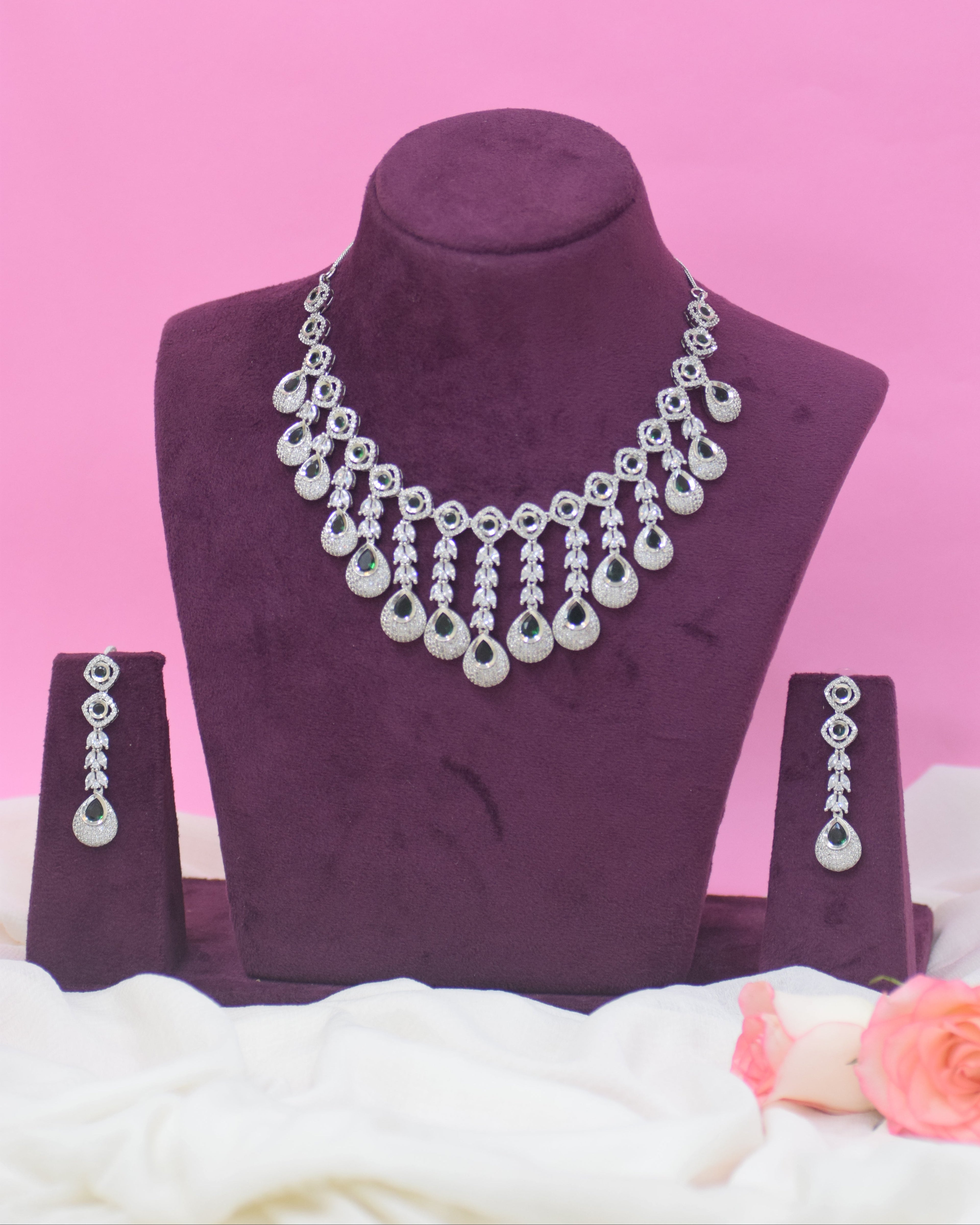 Purple ankle sock with decorative silver beads on a pink background