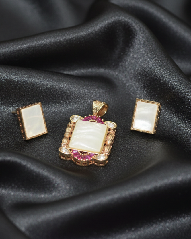 Jewelry set with pendant and earrings on black satin fabric