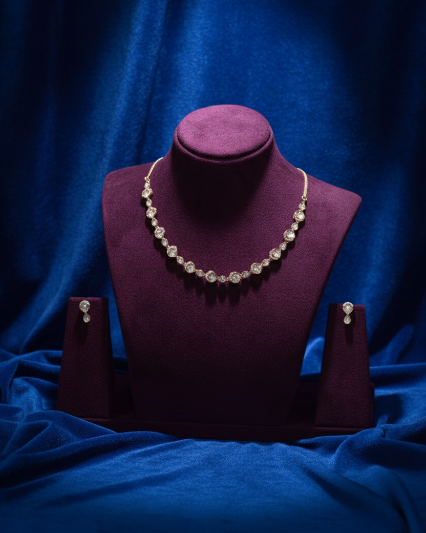Pearl necklace and earrings on a purple mannequin bust against a blue fabric background