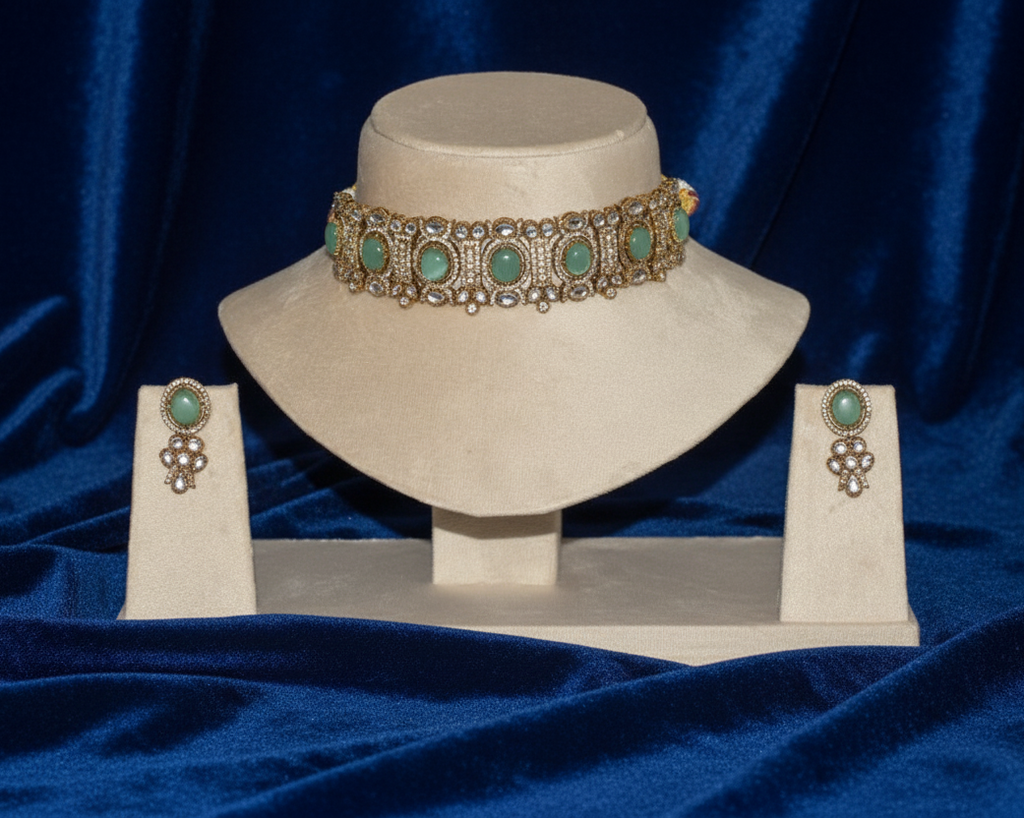 Jewelry set with a choker and earrings on a blue fabric background