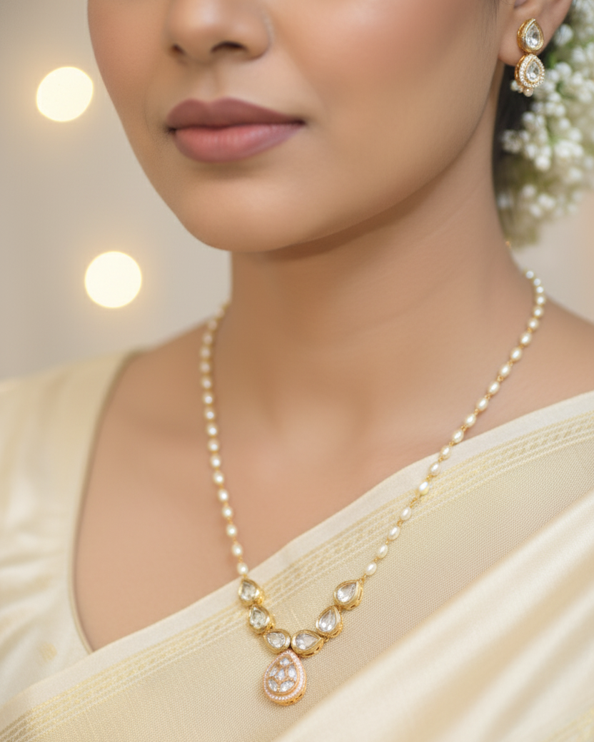 Woman wearing a pearl necklace and earrings with a blurred background