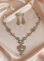 Jewelry set with necklace and earrings on a pink satin background