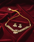 Jewelry set with necklace and earrings on a red fabric background