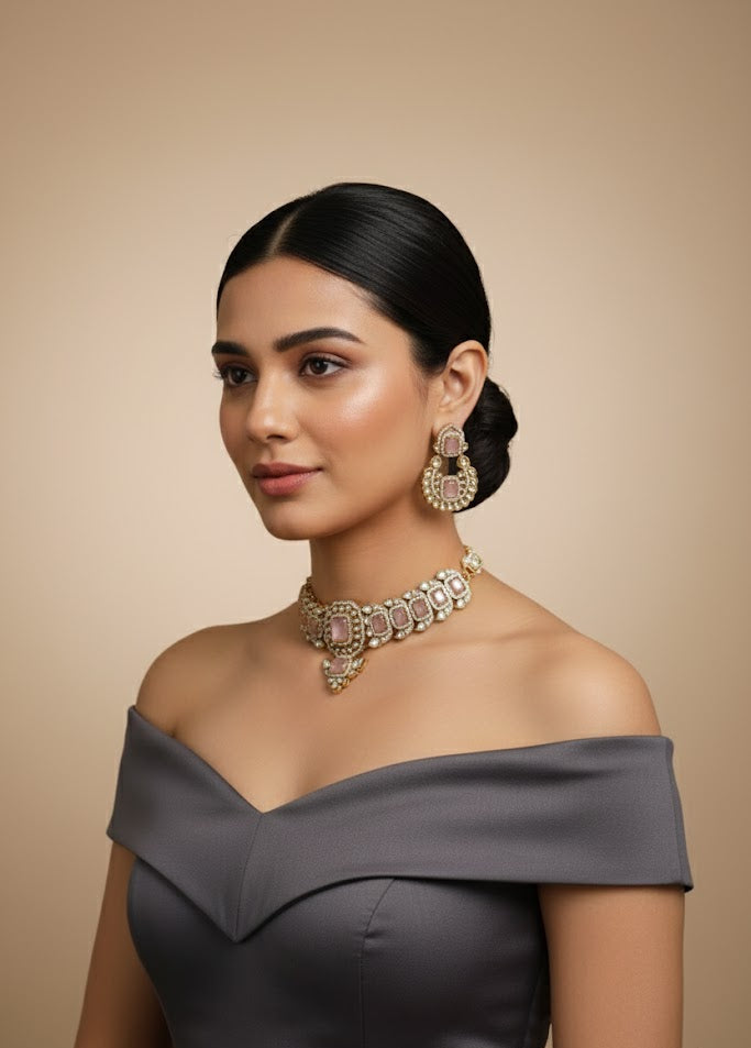 Woman wearing a gray off-shoulder dress with jewelry on a beige background