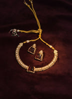 Jewelry set with necklace and earrings on a dark background