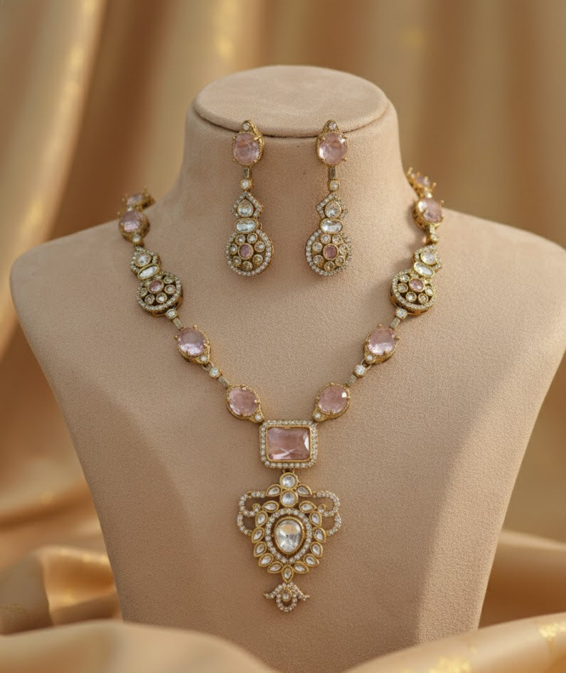 Jewelry set including necklace and earrings on a mannequin bust with a gold background