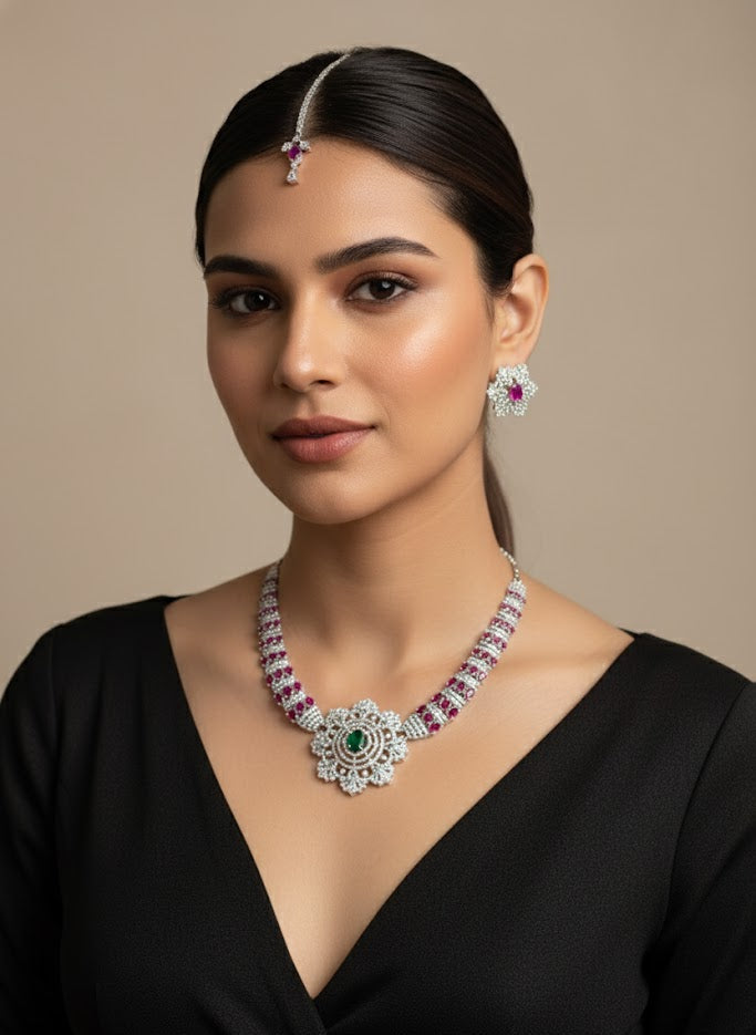 Woman wearing a luxurious necklace, earrings, and headpiece against a beige background