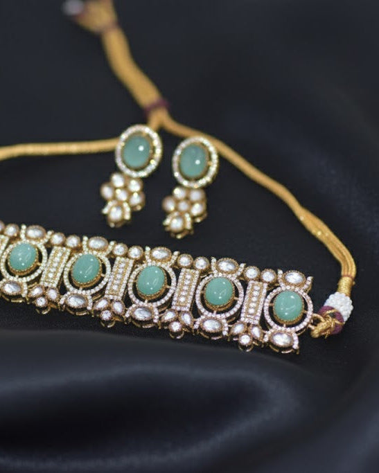 Jewelry set with necklace and earrings on a dark fabric background