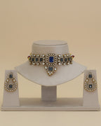 Jewelry set with necklace and earrings on a beige background